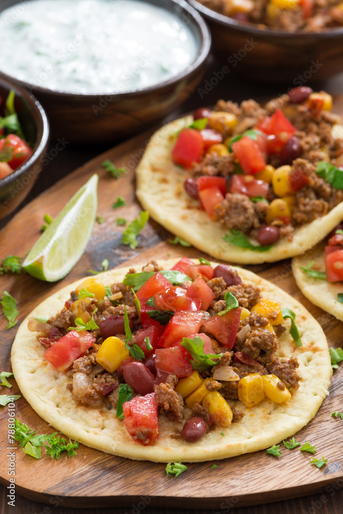 tortillas with chili con carne and tomato salsa on wooden board tortillas with chili con carne and tomato salsa on wooden board