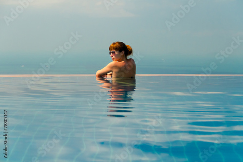 girl with glasses in the swimming pool