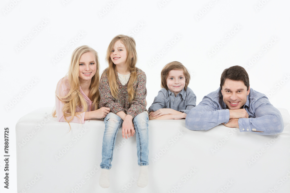 A happy family with two children at home. A happy family with two children at home.