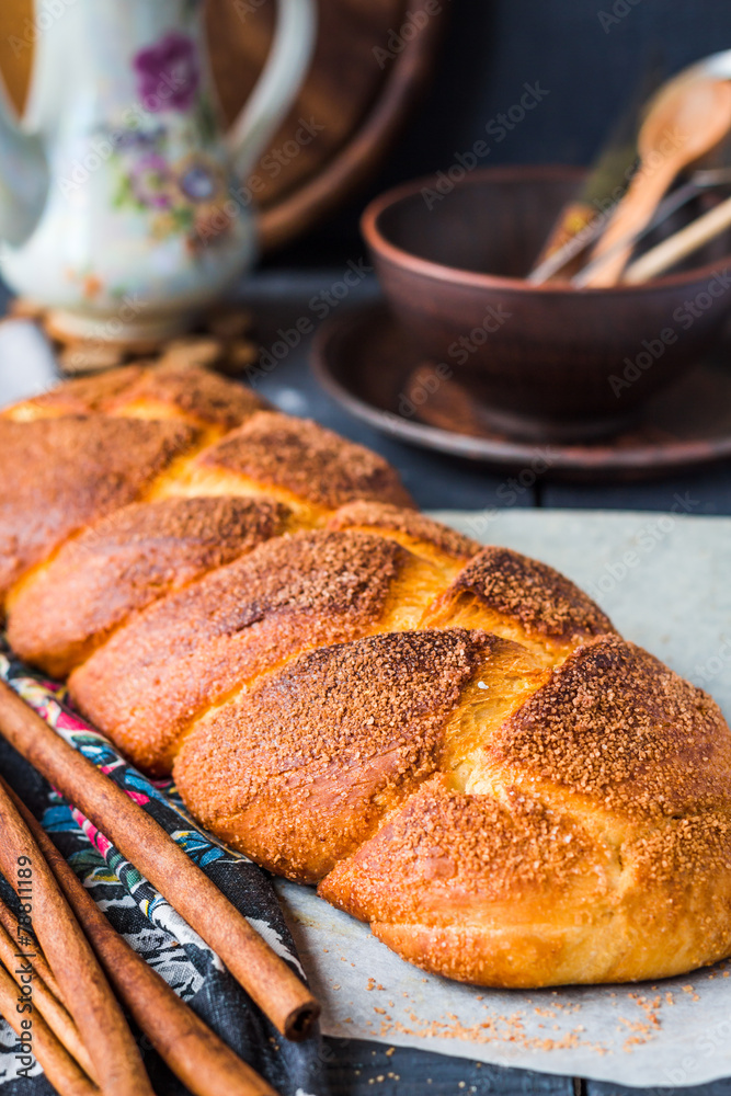 large wicker buns with cinnamon and golden brown