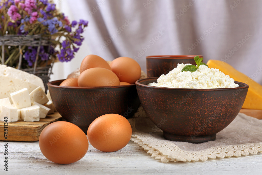 Tasty dairy products with bread and dry flowers Tasty dairy products with bread and dry flowers