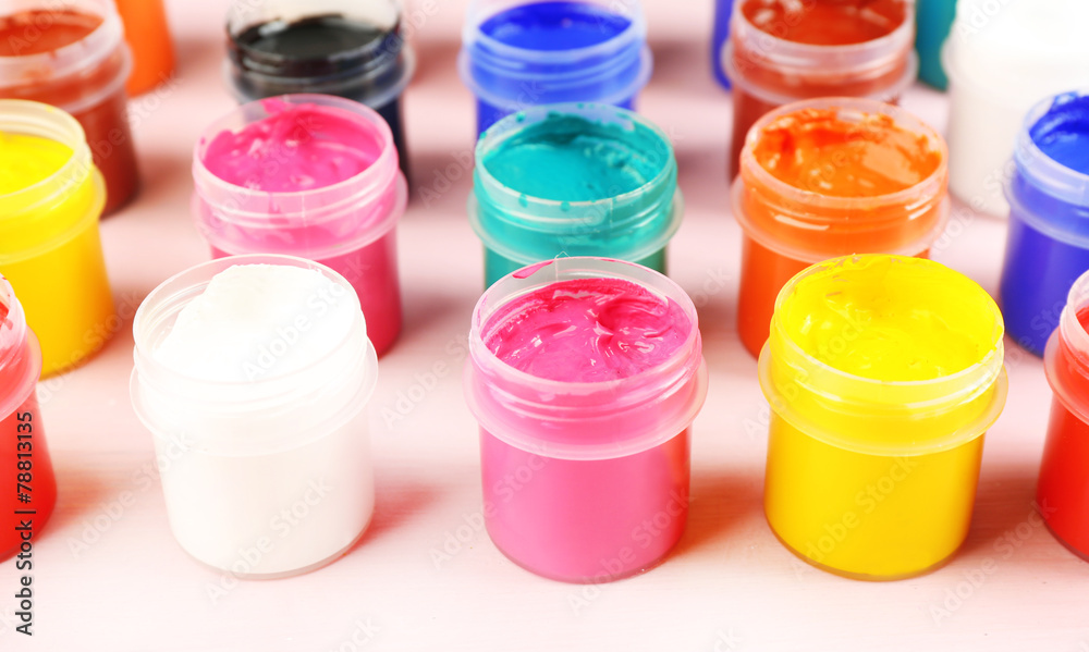 Colorful paint on pink background Colorful paint on pink background