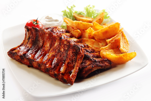 Grilled Pork Rib and Fried Potatoes on Plate