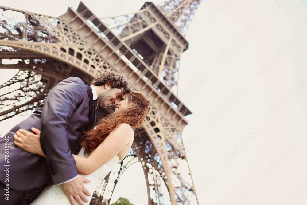 Bride and groom near Eiffel tower