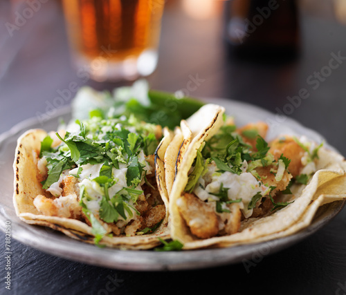 fish tacos with slaw, lemon zest and cilantro