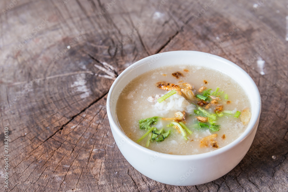 Bowl of oats porridge on wooden table. Healthy breakfast Bowl of oats porridge on wooden table. Healthy breakfast