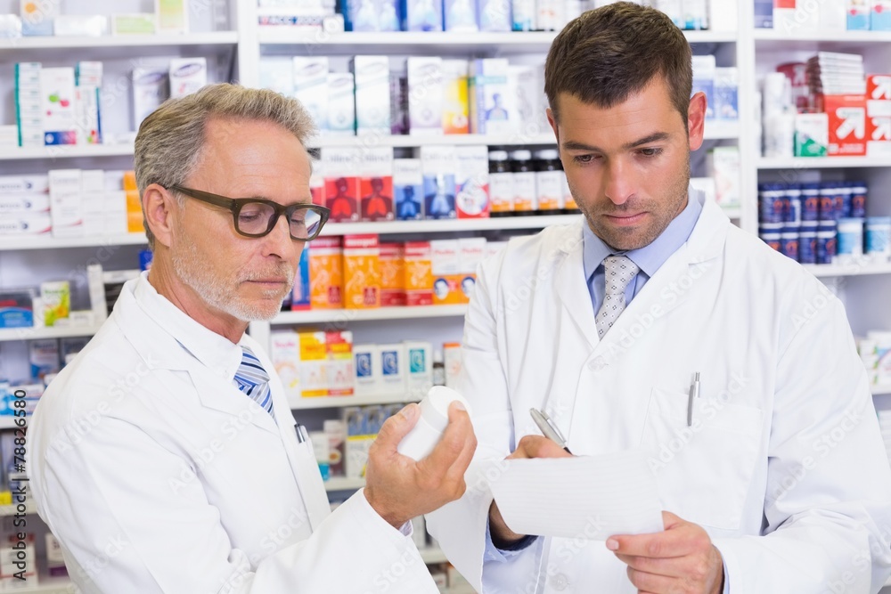 Pharmacist looking a medication for a prescription Pharmacist looking a medication for a prescription