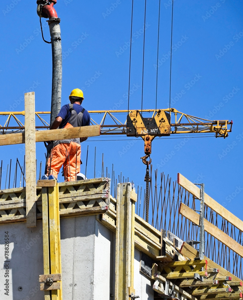 Naklejka premium Man is working at the construction site