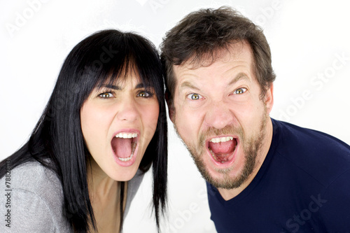 Man and woman shouting like crazy looking isolated