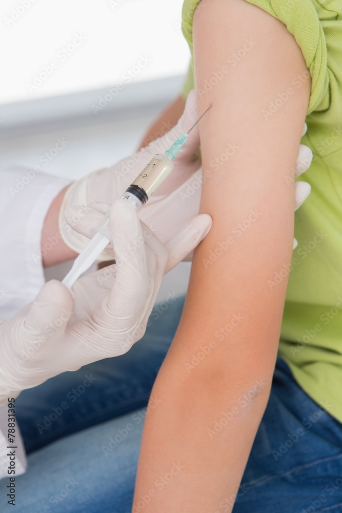 Doctor doing injection at little boy Doctor doing injection at little boy