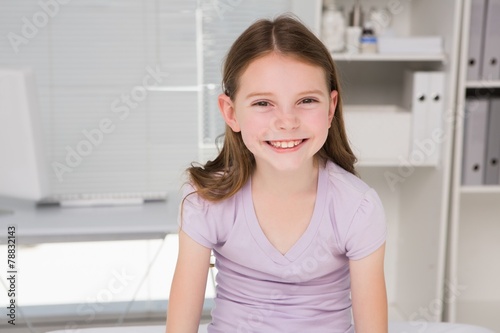 Smiling little girl looking at camera