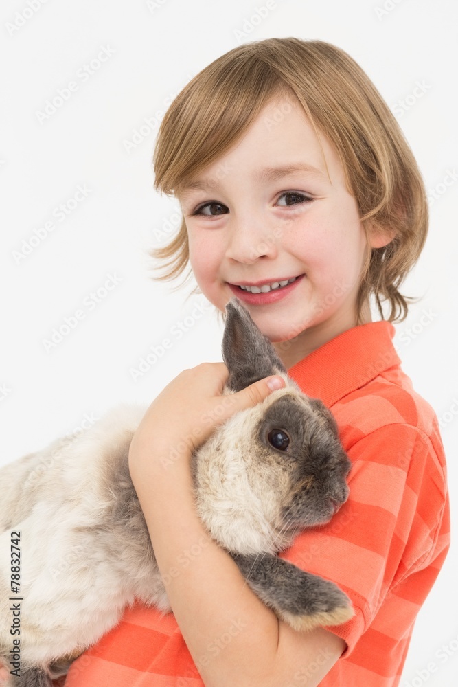 Portrait of happy boy holding fluffy rabbit Portrait of happy boy holding fluffy rabbit
