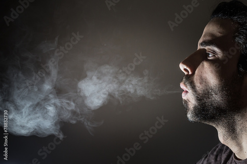 Profile of a person smoking
