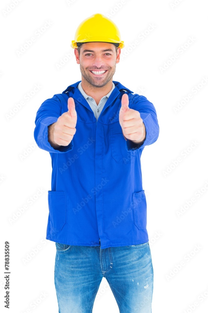 Portrait of happy manual worker gesturing thumbs up