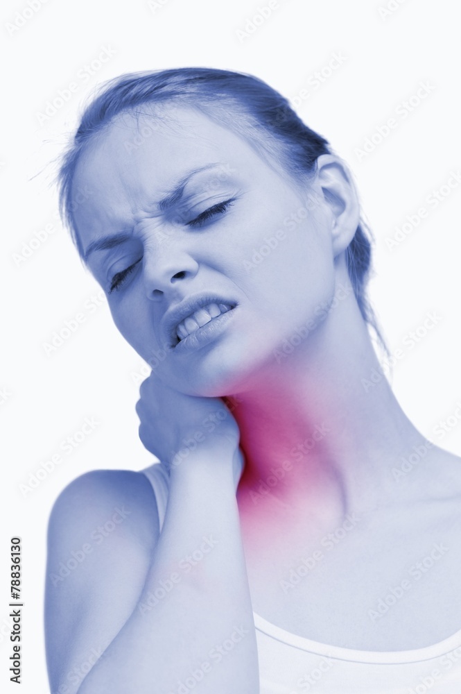 Young woman massaging her painful nape Young woman massaging her painful nape