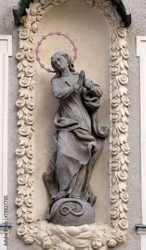 Virgin Mary  statue on the house facade in Graz  Austria
