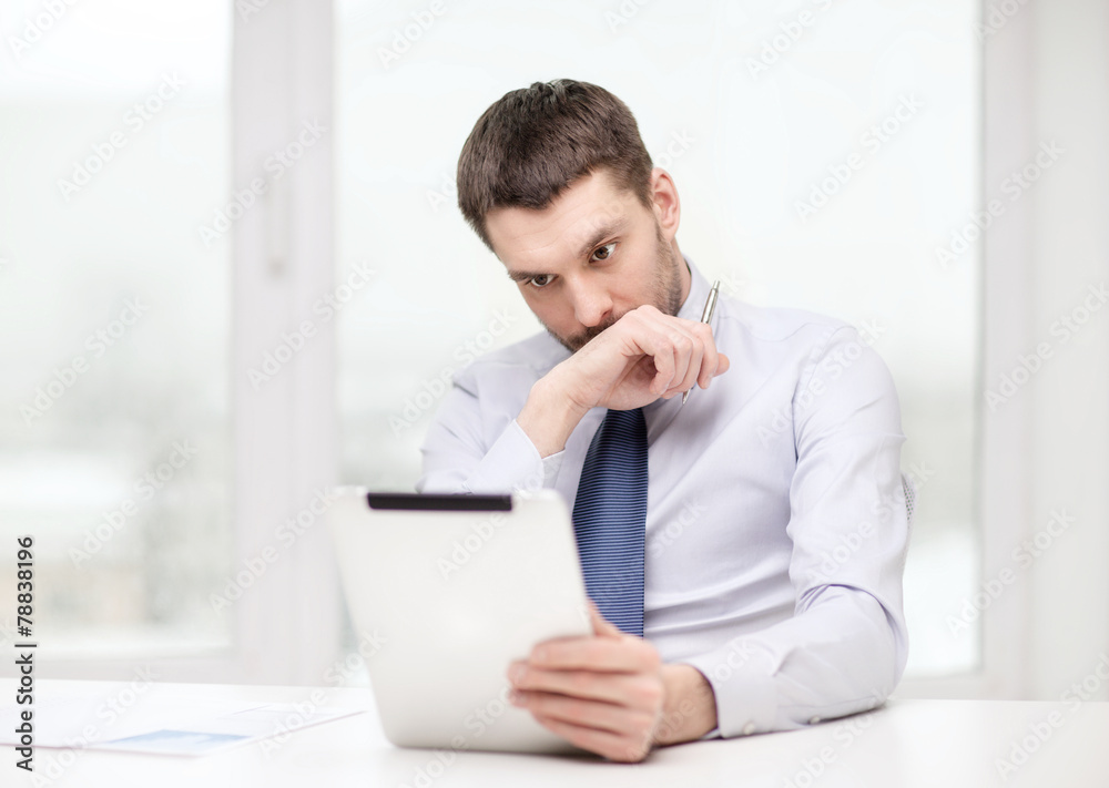 stressed businessman with tablet pc and documents stressed businessman with tablet pc and documents
