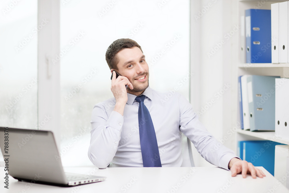 businessman with laptop and smartphone at office businessman with laptop and smartphone at office