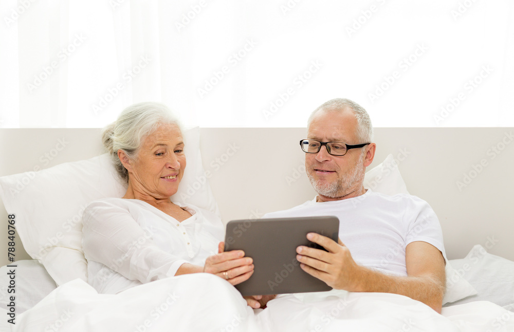 happy senior couple with tablet pc at home happy senior couple with tablet pc at home