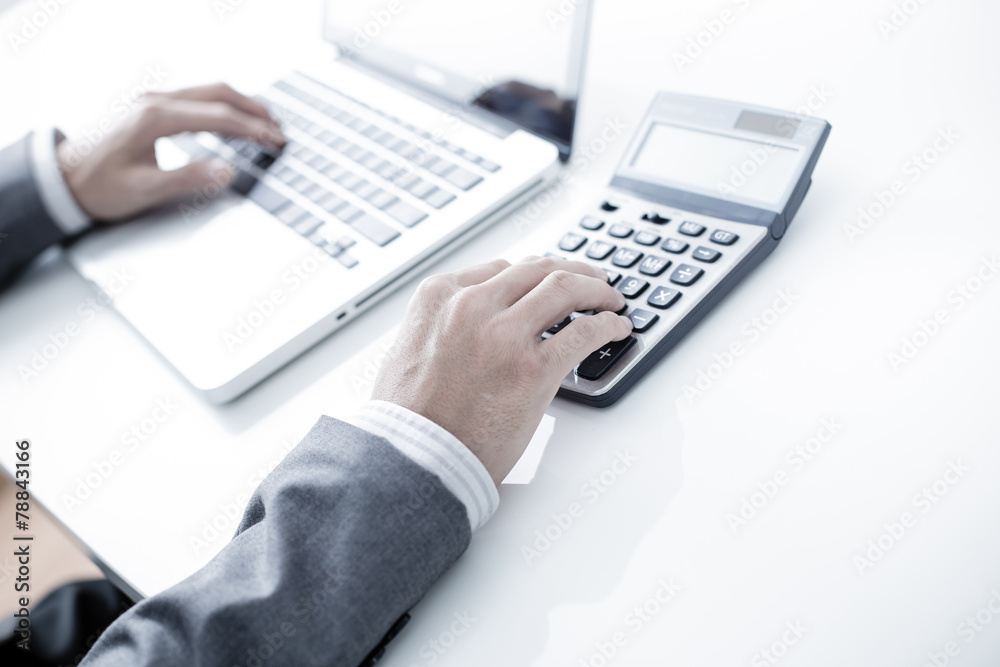 Closeup of businessman hands typing on laptop computer Closeup of businessman hands typing on laptop computer