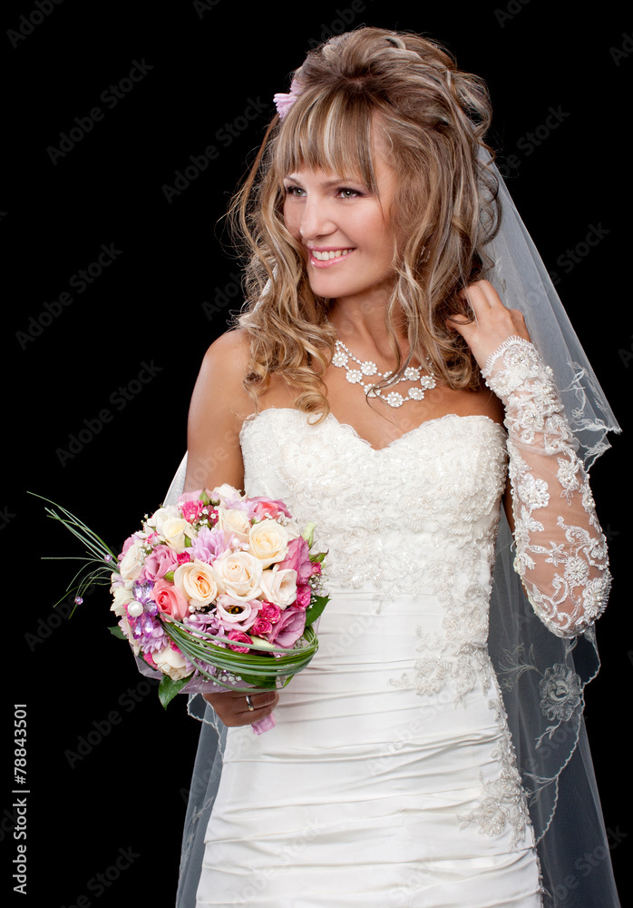 Naklejka premium Happy beautiful bride on black background with bouquet of weddin