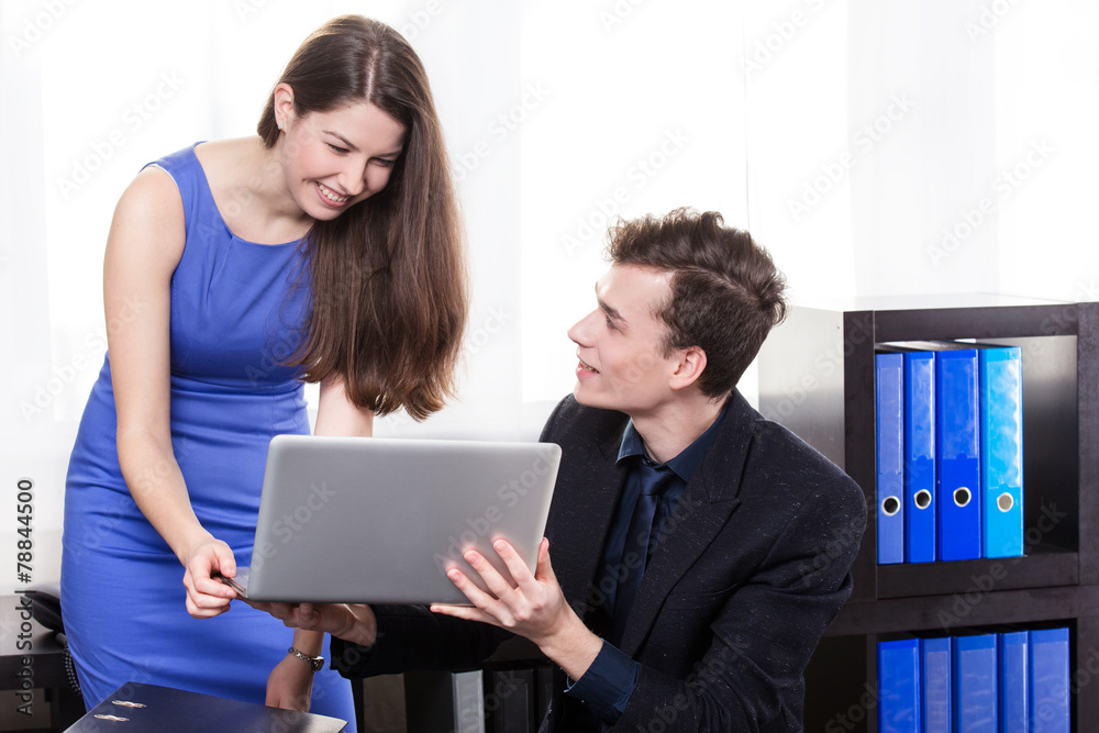 business man shows the laptop to his colleague