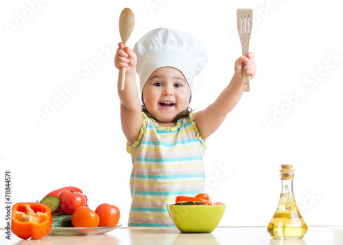 Smiling little cook with la...
