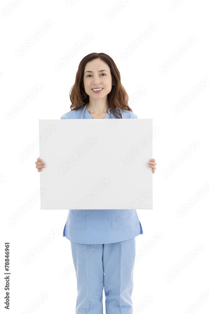 Female doctor or nurse showing a blank poster Female doctor or nurse showing a blank poster
