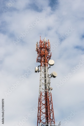 telecommunications tower with many satellite dish