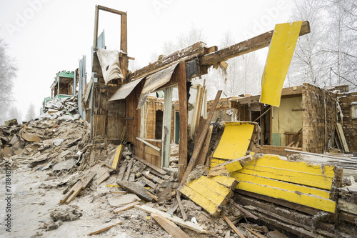 The demolition of the old dilapidated housing.