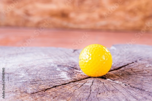 Yellow Miniature Golf Ball On White Background.