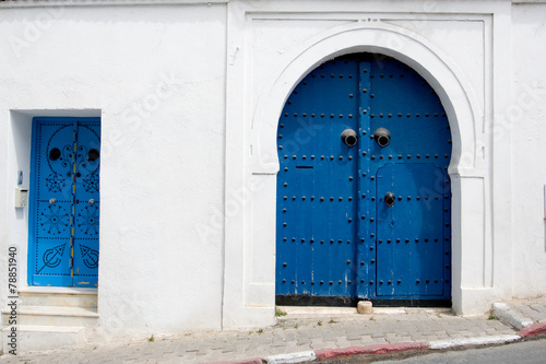 Blue doors and white wall of building in Sidi Bou Said, Tunisia