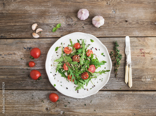 Salad with arugula  cherry tomatoes  sunflower seeds and herbs