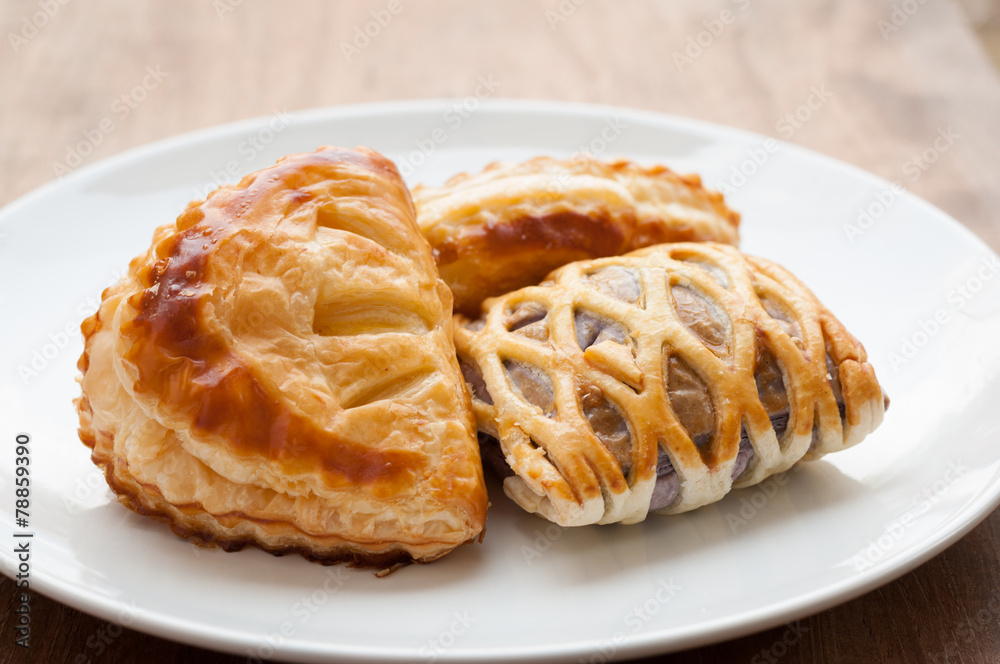 homemade fresh fruit pies on white dish homemade fresh fruit pies on white dish
