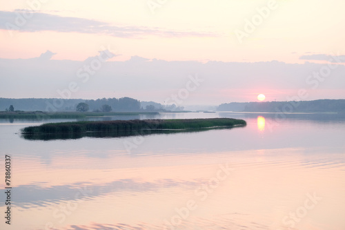 panorama of the morning mist on the lake in the woods