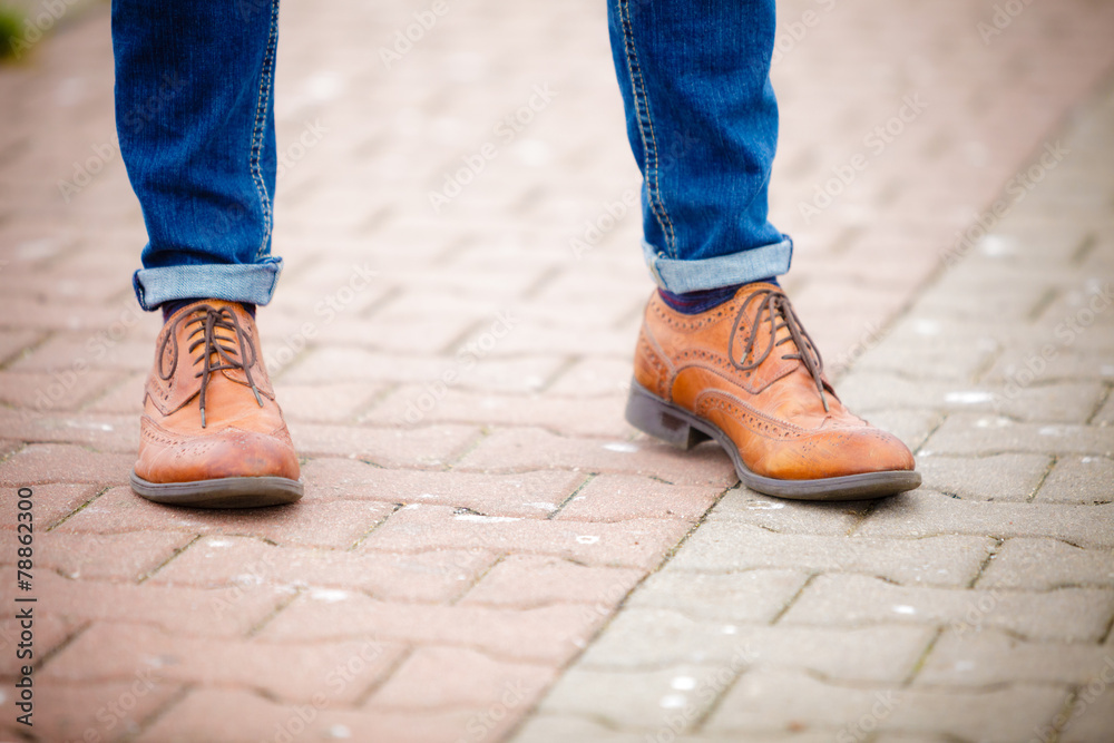 Male legs in jeans and boots Male legs in jeans and boots