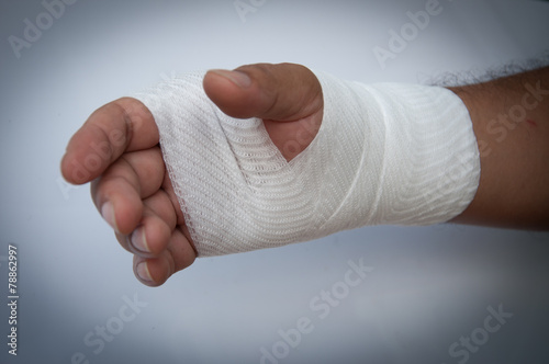 Hand injury,male hand wearing white bandage