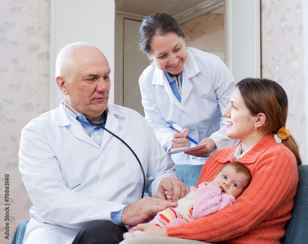 Fototapeta premium doctor examining three months baby
