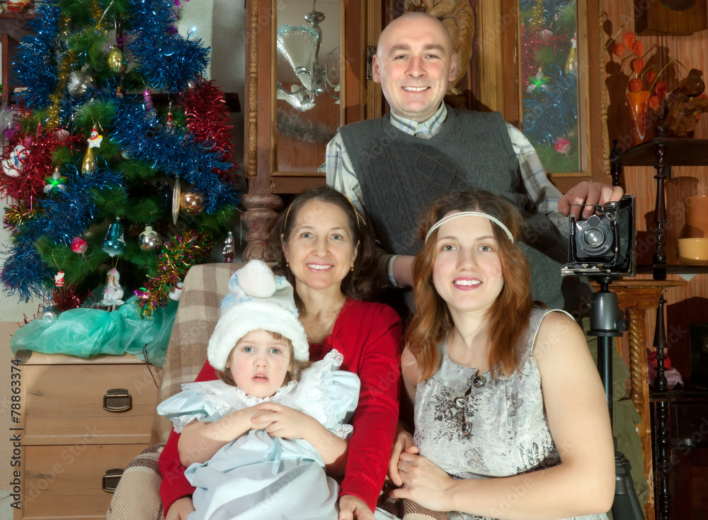   family posing for Christmas portrait