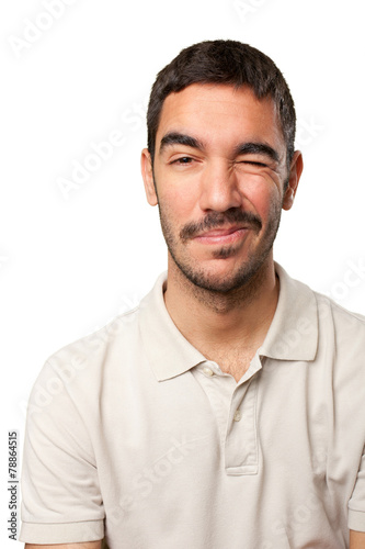 Young man winking an eye