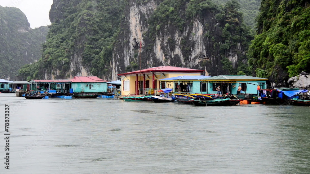 Floating Fishing Village from Boats POV - Ha Long Bay Vietnam Floating Fishing Village from Boats POV - Ha Long Bay Vietnam