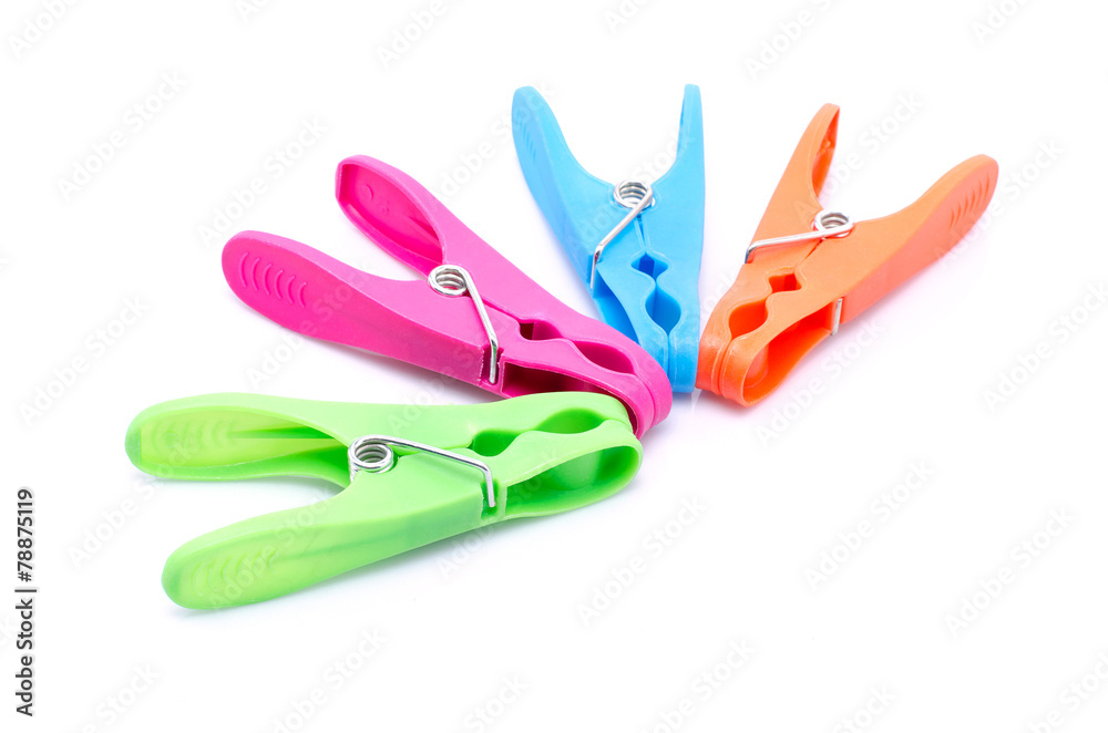 Four colored clothespin on white background
