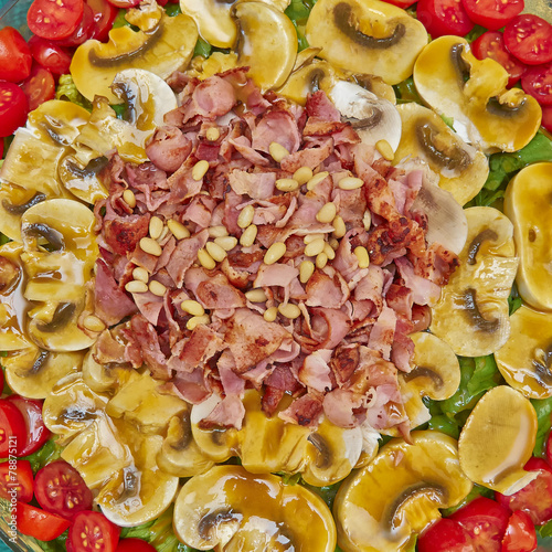 gourmet salad with spicy bacon, mushrooms and cherry tomatoes