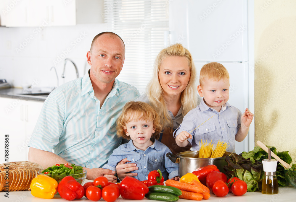Happy family at kitchen.