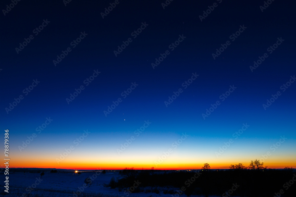 The first stars in the background of a bright sunset. The first stars in the background of a bright sunset.