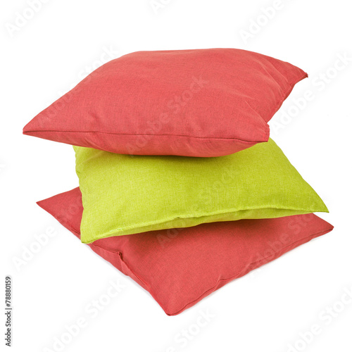 Stack of three cushions or pillows isolated on white background