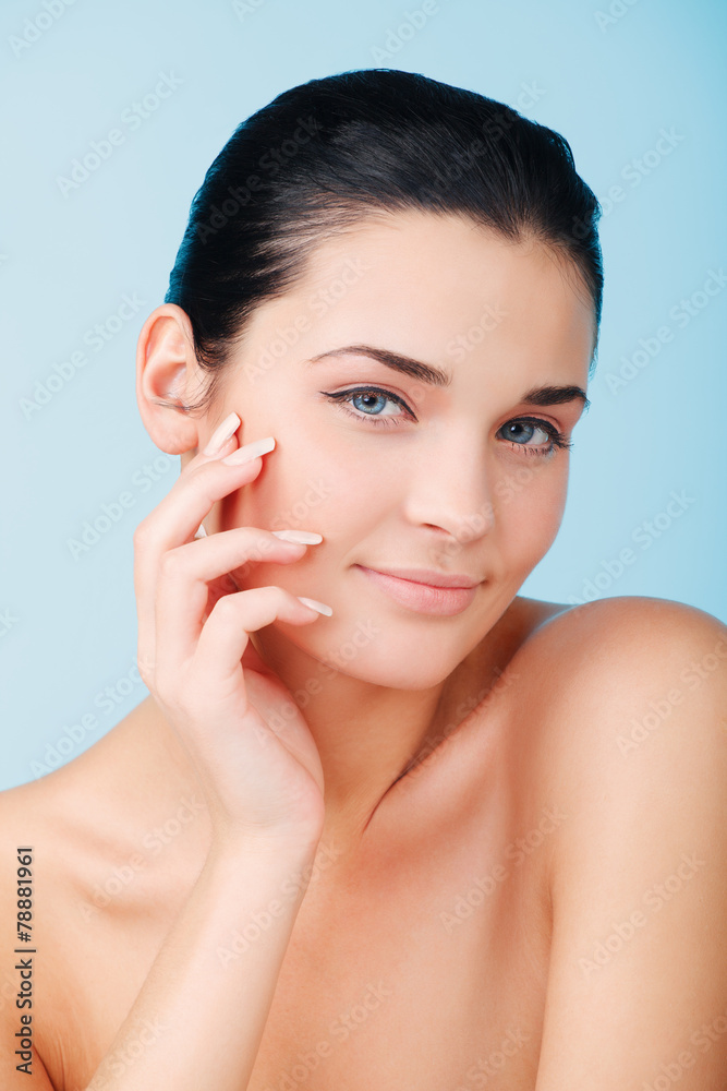 Close-up portrait of beautiful, fresh, over blue background Close-up portrait of beautiful, fresh, over blue background