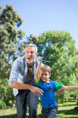 Father and son having fun in the park © WavebreakMediaMicro