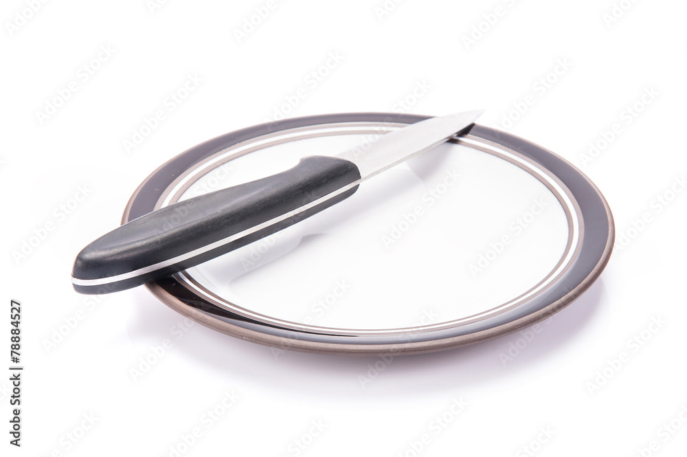 Fototapeta premium knife and plate on white background