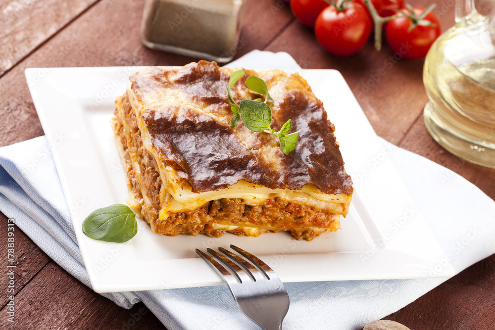 Portion of tasty lasagna on a plate Portion of tasty lasagna on a plate